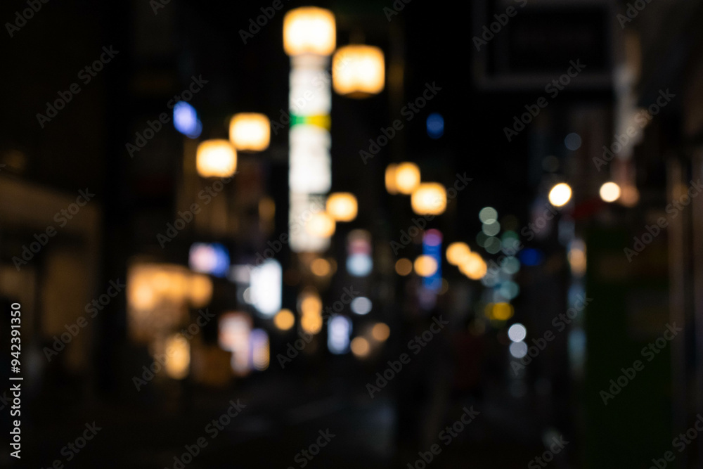 Bokeh background of city with buildings and neon billboard in the night Bokeh background of city with buildings and neon billboard in the night