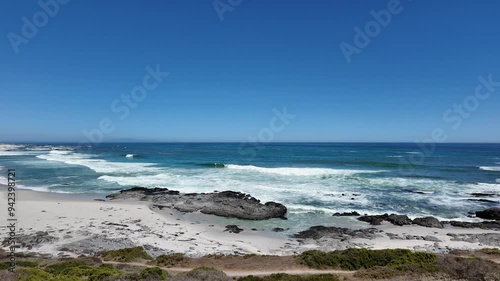 Yzerfontein Western Cape South Africa, 27.03.2024. Video. Clifftop view of the tidal waves and rocky beach area at Yzerfontein  on the west coast of South Africa. photo