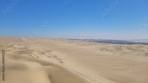 Sand dunes desert city Peru