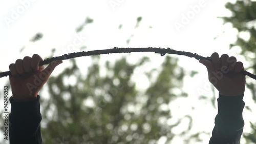 tree, branch, break, camp, camper, day, firewood, flora, hand-held, hiker, hiking, knee, male, man, national forest, natural, nature, 1 person, rain, rock, rugged, slow motion, spring, stick, summer, 