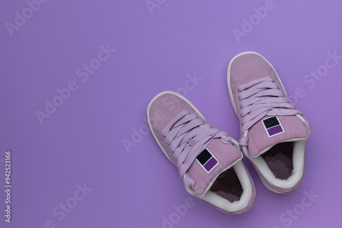 Purple Sneakers on Lilac Background: Stylish Footwear Flat Lay for Fashion Trends photo