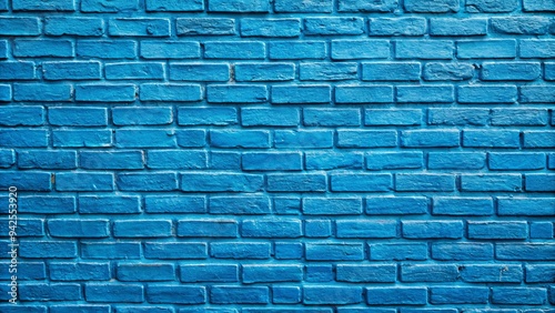 Blue brick wall background with textured painted bricks, perfect for adding a pop of color to any project