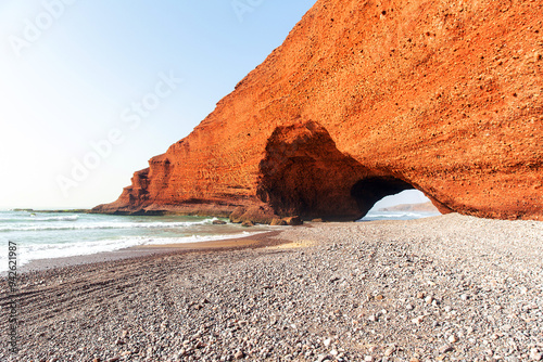 Spectacular natural red arch on atlantic ocean coast, Legzira (or Gzira) beach. Red archs on atlantic ocean coast. Sidi Ifni, Morocco, Africa photo