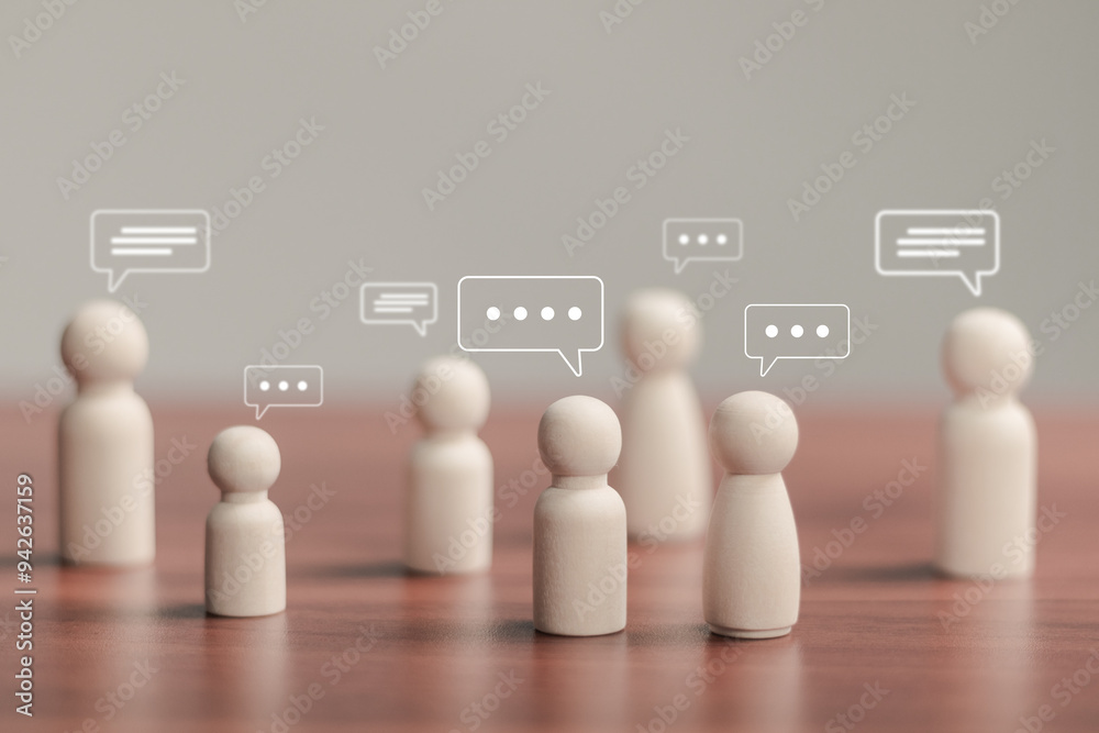 © Pakin - Business meeting concept, Wooden figure with team discussion. Teamwork and team discussion for exchange information or ideas.