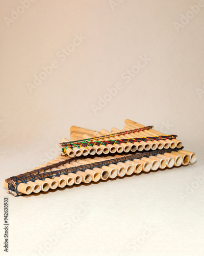 Panpipes on beige background isolated. Rondador. Andean Instruments. South American instruments. Wind instruments. Pan flute.