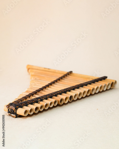 Panpipes on beige background isolated. Rondador. Andean Instruments. South American instruments. Wind instruments. Pan flute.