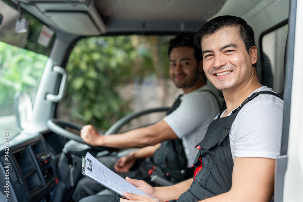 Portrait of Caucasian delivery man delivering package in the truck. Portrait of Caucasian delivery man delivering package in the truck.