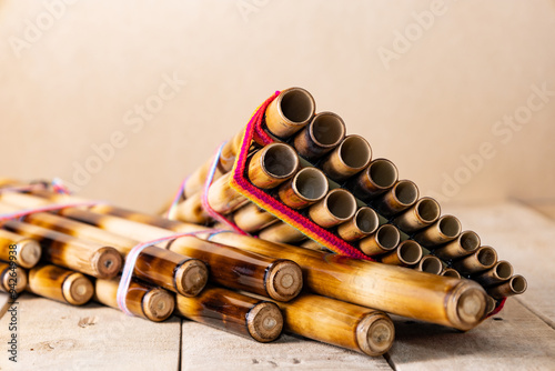 Panpipes on beige background isolated. Zampoña. Andean Instruments. South American instruments. Wind instruments. Pan flute.