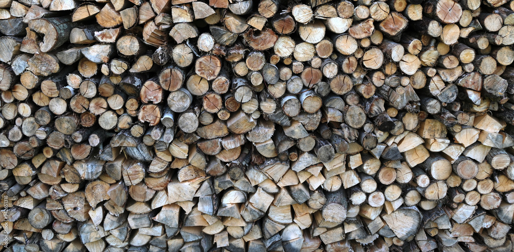 A pile of firewood stacked and prepared for winter. A pile of firewood stacked and prepared for winter.