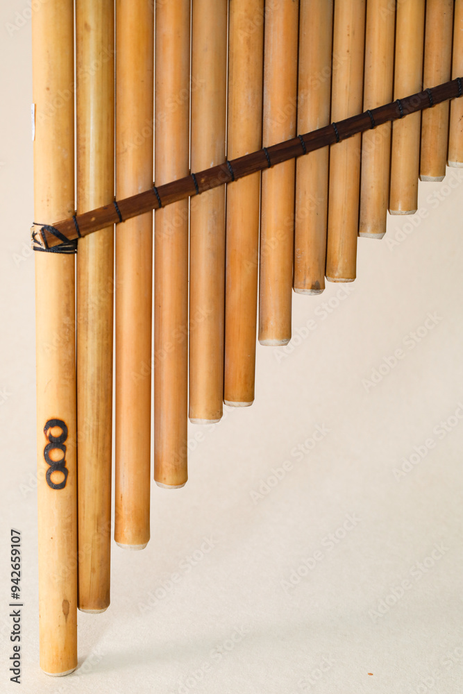 Panpipes on beige background isolated. Rondador. Andean Instruments. South American instruments. Wind instruments. Pan flute. Panpipes on beige background isolated. Rondador. Andean Instruments. South American instruments. Wind instruments. Pan flute.