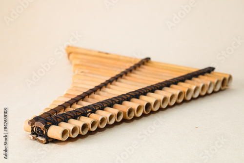 Panpipes on beige background isolated. Rondador. Andean Instruments. South American instruments. Wind instruments. Pan flute.