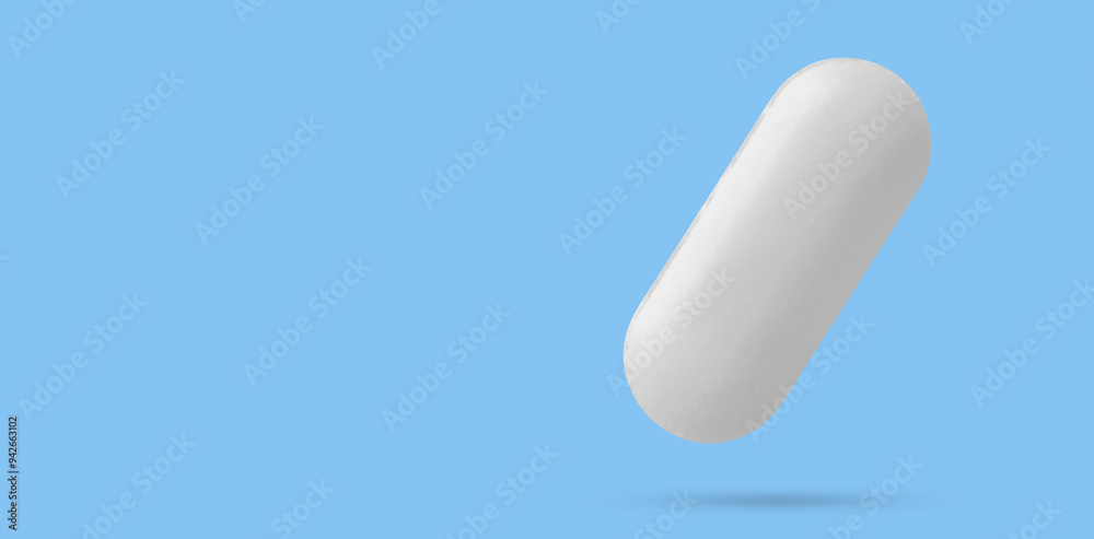 White medicine pill tablet float on blue background White medicine pill tablet float on blue background