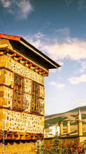 Tarihi Erzurum Tas Evleri or Traditional Erzurum stone houses on cobblestone street. photo