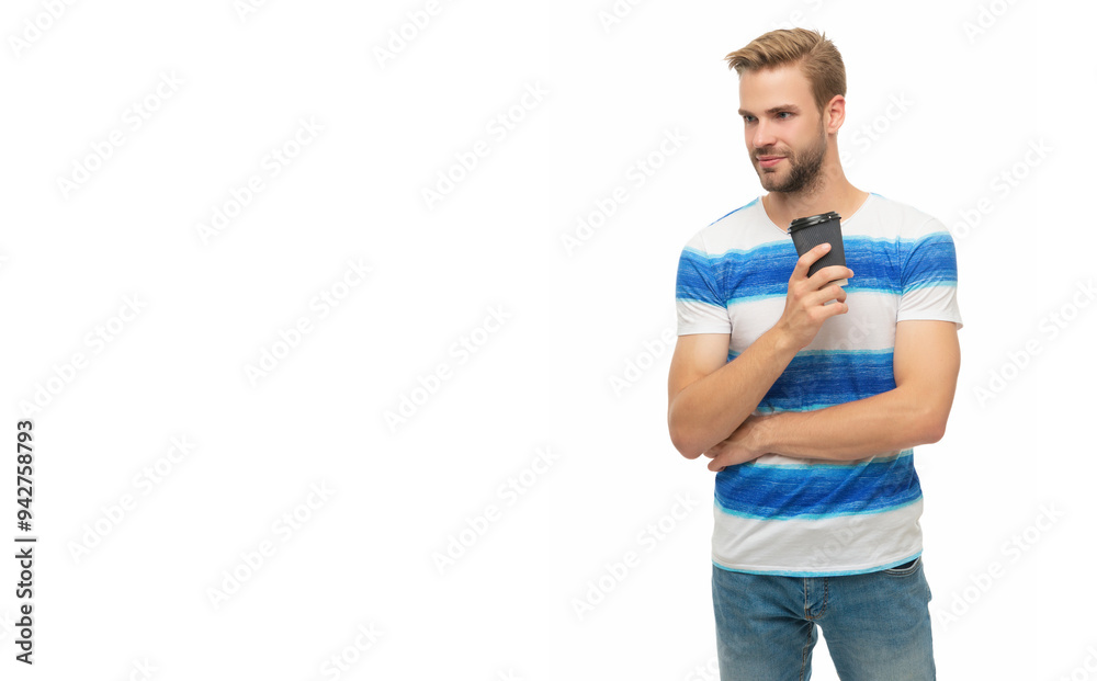 Fototapeta premium Young man in casual t-shirt holding paper cup of coffee. Drink hot tea isolated on white. Man relaxing with coffee. Takeaway coffee cup. Millennial man enjoying cup of coffee. Copy space banner