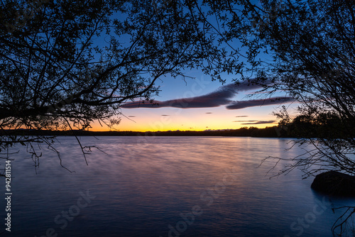 Landscape with the Valparaíso Reservoir at sunset through the vegetation, Zamora, Castilla y León, Spain.