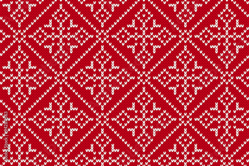 Knit winter red pattern. Holiday fair traditional ornament. Christmas seamless background. Festive print with snowflakes. Knitted Xmas sweater texture. Vector illustration.