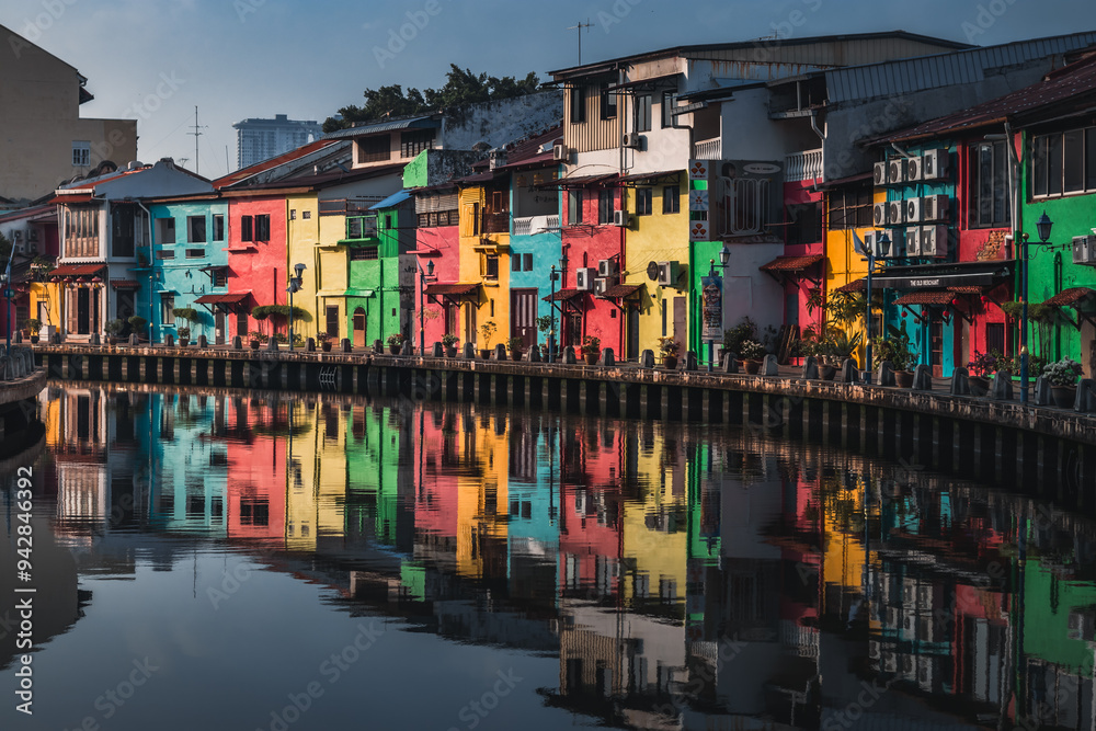 Colourful buildings on the edge of a calm river. Colourful buildings on the edge of a calm river.
