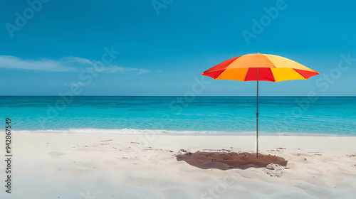 Brightly colored umbrella on a sandy beach