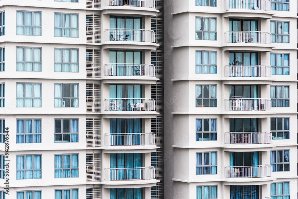 Close up view on the residential building, repeating objects - windows and balconies. Abstract pattern. Close up view on the residential building, repeating objects - windows and balconies. Abstract pattern.