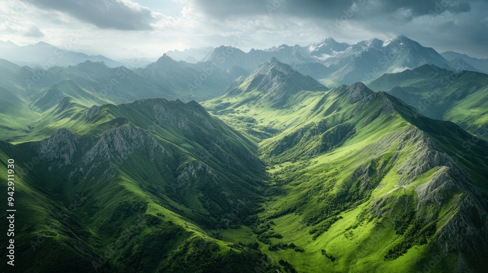 Lush Green Mountain Ranges Under a Cloudy Sky Lush Green Mountain Ranges Under a Cloudy Sky