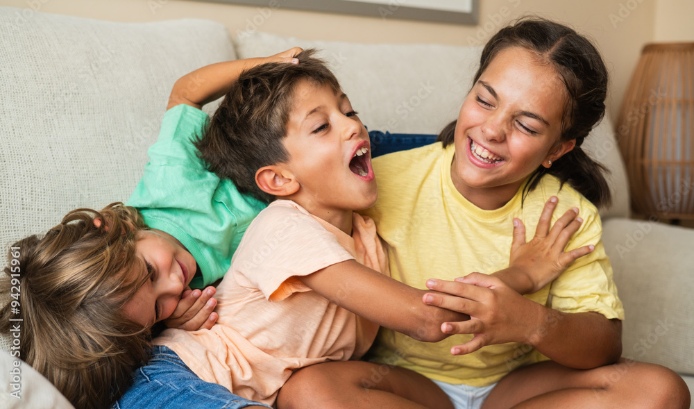 Smiling And Joyful Kids At Home, Engaged In Playful Mischief And Embracing Each Other. Positive Emotions And Happy Childhood Moments Captured In A Cozy Environment. Smiling And Joyful Kids At Home, Engaged In Playful Mischief And Embracing Each Other. Positive Emotions And Happy Childhood Moments Captured In A Cozy Environment.