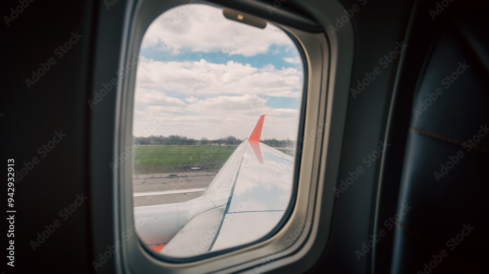 view from the airplane window of the airport during takeoff view from the airplane window of the airport during takeoff