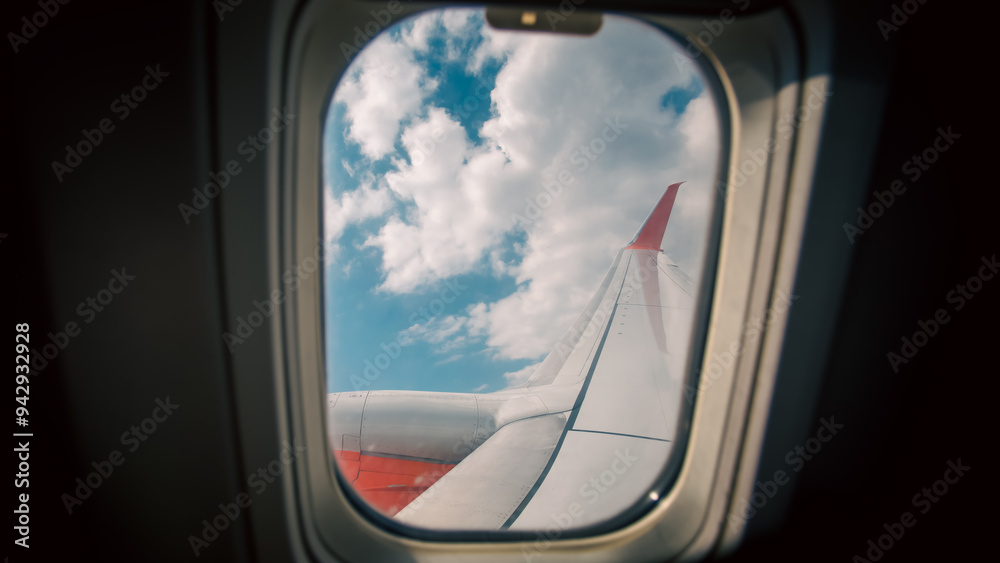 view from the airplane window to the blue sky and white clouds view from the airplane window to the blue sky and white clouds