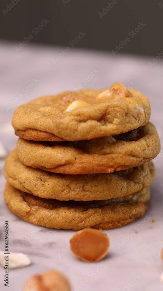 The cookies are golden brown with a slightly crispy edge and a soft, chewy center. Some cookies have chocolate chips The cookies are golden brown with a slightly crispy edge and a soft, chewy center. Some cookies have chocolate chips