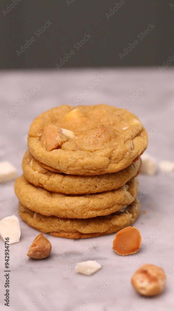 The cookies are golden brown with a slightly crispy edge and a soft, chewy center. Some cookies have chocolate chips The cookies are golden brown with a slightly crispy edge and a soft, chewy center. Some cookies have chocolate chips