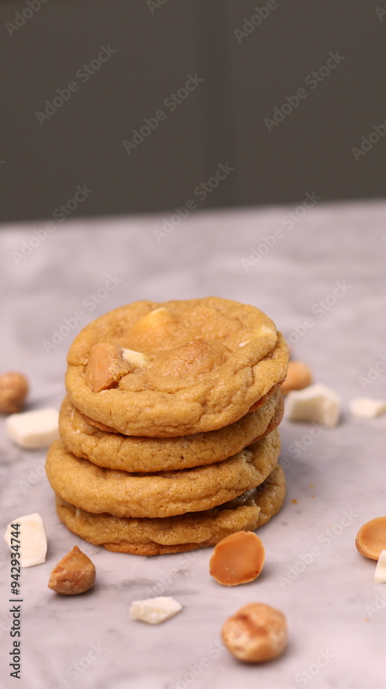 The cookies are golden brown with a slightly crispy edge and a soft, chewy center. Some cookies have chocolate chips The cookies are golden brown with a slightly crispy edge and a soft, chewy center. Some cookies have chocolate chips