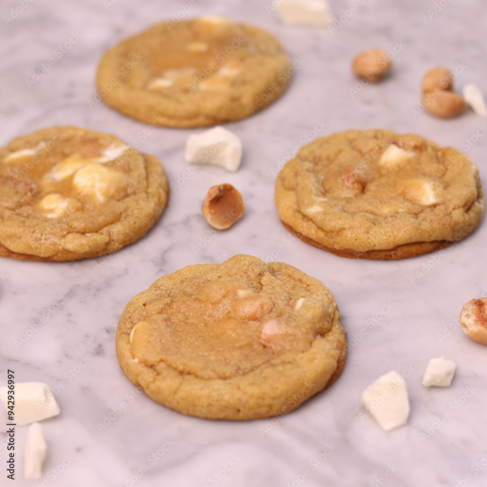 The cookies are golden brown with a slightly crispy edge and a soft, chewy center. Some cookies have chocolate chips The cookies are golden brown with a slightly crispy edge and a soft, chewy center. Some cookies have chocolate chips