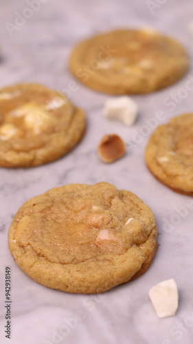 The cookies are golden brown with a slightly crispy edge and a soft, chewy center. Some cookies have chocolate chips