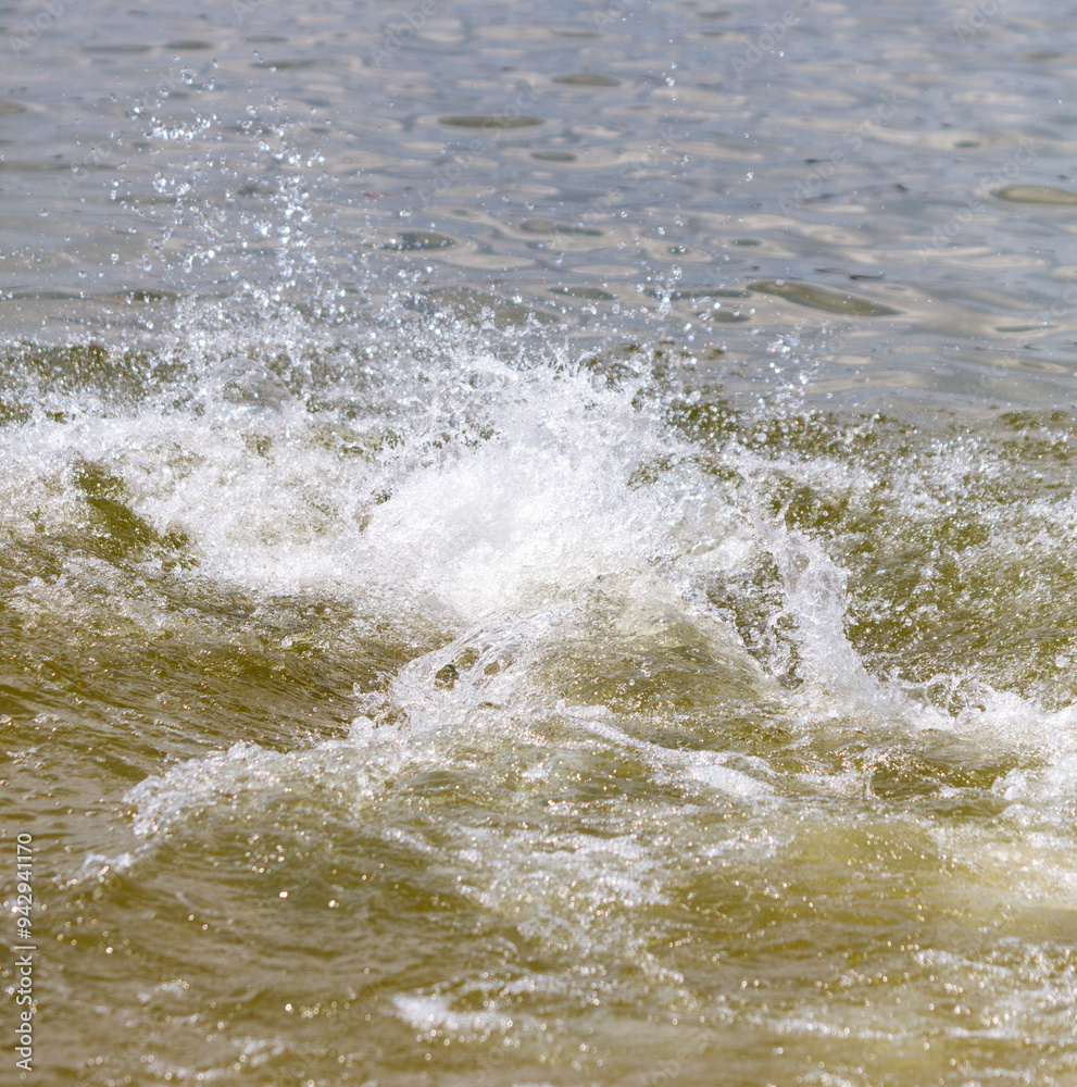 Splashes of water on the surface of the sea Splashes of water on the surface of the sea