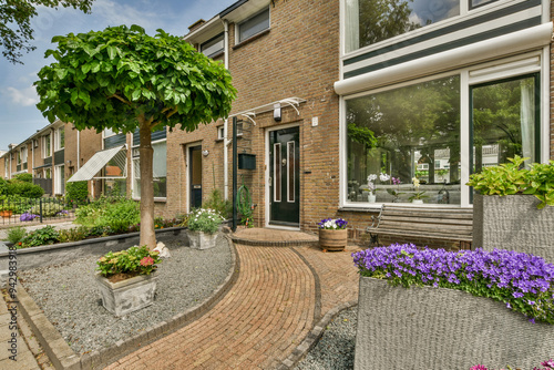 Quaint suburban home with well-kept garden and pathway