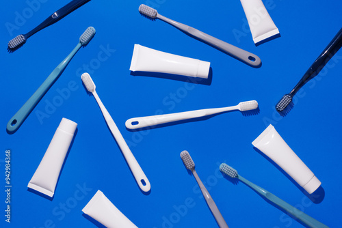 Various dental hygiene products on a vibrant blue background