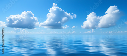 Serene Ocean Scene with Clear Blue Skies and Fluffy White Clouds Reflecting Tranquil Water Beauty