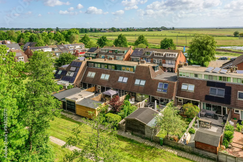 Aerial view of a suburban neighborhood with green spaces photo