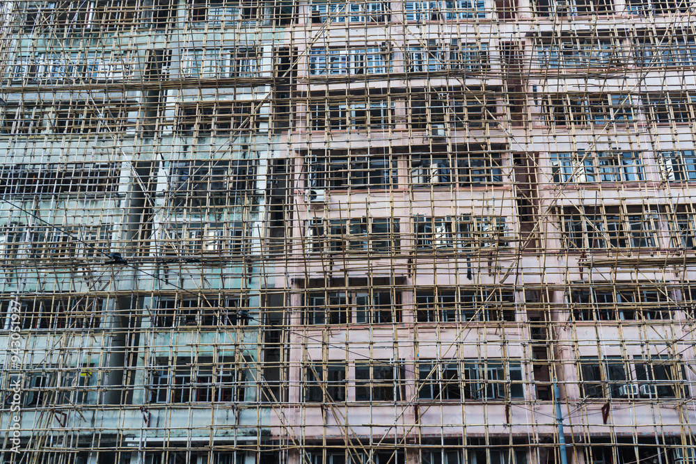 Exterior of building in Hong Kong with bamboo scaffolding Exterior of building in Hong Kong with bamboo scaffolding
