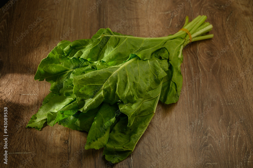 Fresh leaves of spinach on rustic wooden table. Fresh leaves of spinach on rustic wooden table.