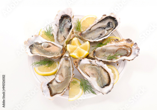 Fototapeta Naklejka Na Ścianę i Meble -  fresh opened oyster on plate isolated on white background