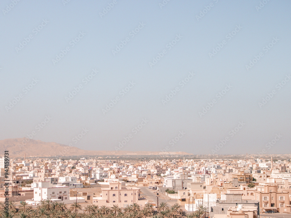 Middle Eastern city view with rooftops and blue sky, Oman Middle Eastern city view with rooftops and blue sky, Oman