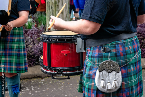 scottish pipe band snare drummer drum, traditional bagpipe music ensemble, tartan kilt with sporran photo