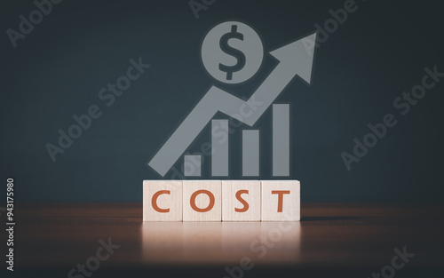 COST text on wooden blocks . Decreasing costs and cost management, control, reduction, optimization of costs.
