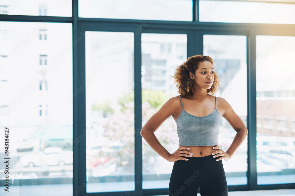 Gym, woman and serious for exercise as personal trainer in class for cardio with fitness, workout and training. Female person, instructor and confident for wellness, health and wellbeing for care