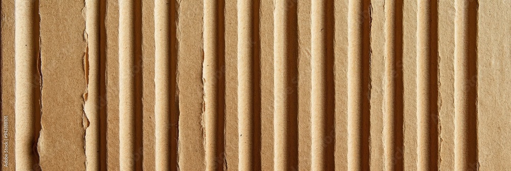 Close-Up of Cardboard Texture with Vertical Lines in a Natural Brown Toned Composition Close-Up of Cardboard Texture with Vertical Lines in a Natural Brown Toned Composition