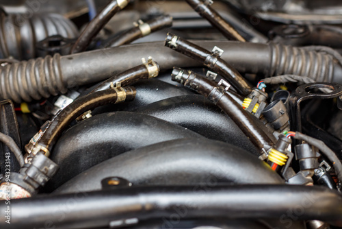 Under the hood of an old German car during repairs.