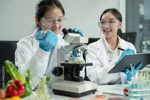 Team Microbiologists Analyzing Molecular Samples in Advanced Food Science Laboratory, Dietitian food and medicine.