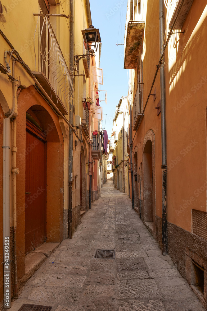 Fototapeta premium A street between old houses of Isernia, a city in Molise, Italy.
