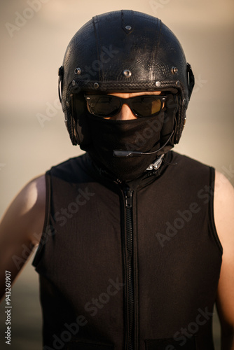 Biker in Full Gear with Helmet and Goggles.. photo