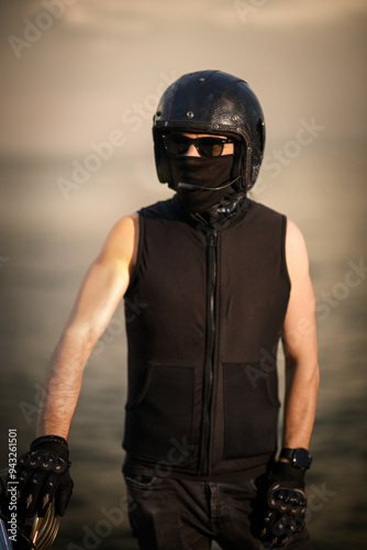 Biker in Full Gear with Helmet and Goggles.. photo